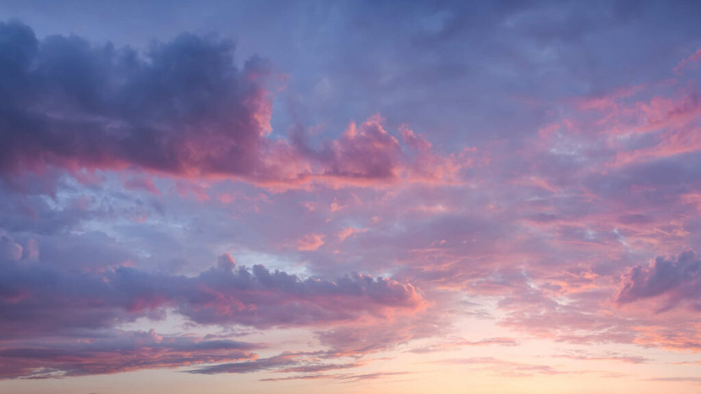 Calming pink evening sky with clouds